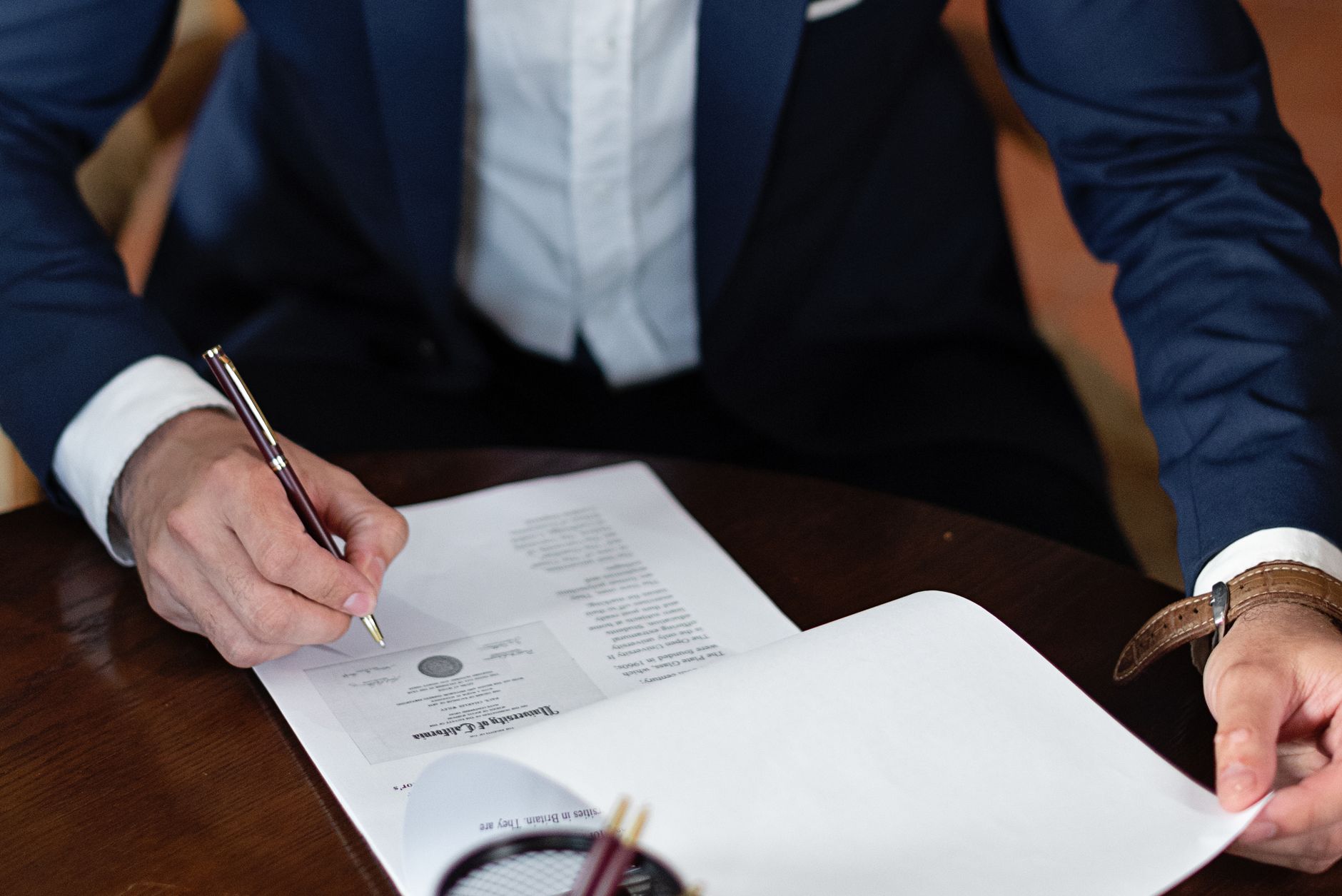 Business partners reviewing international contracts