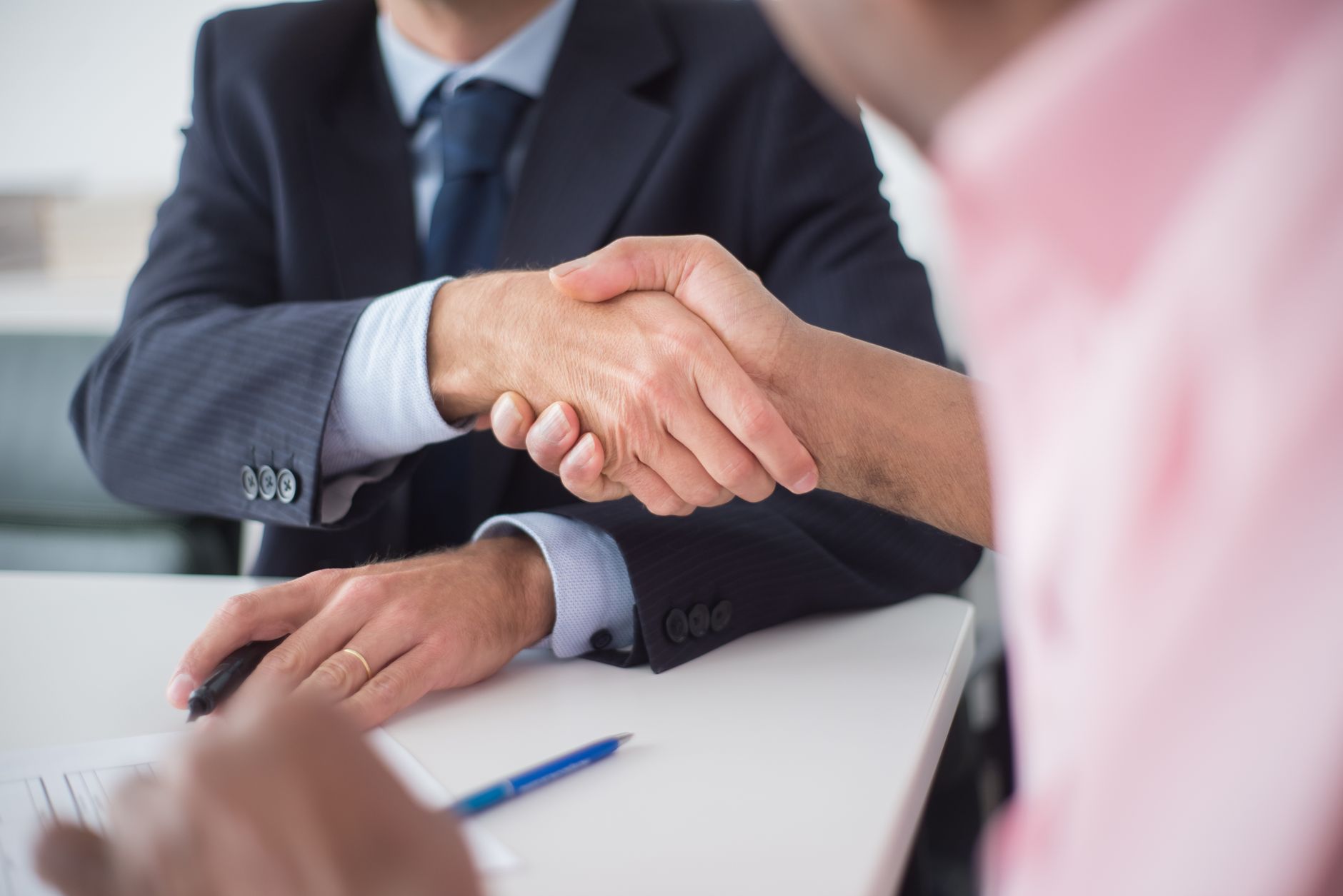 Attorneys executing legal contract papers